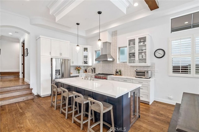 1715 Reed St, Redondo Beach, CA 90278 - kitchen featuring stainless steel fridge with ice dispenser, a breakfast bar, dark wood-type flooring, tasteful backsplash, and ornamental molding