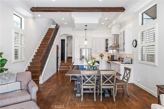 1715 Reed St, Redondo Beach, CA 90278 - dining room with beamed ceiling, arched walkways, dark wood finished floors, stairway, and recessed lighting