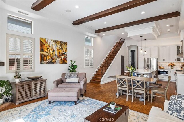 1715 Reed St, Redondo Beach, CA 90278 - living room featuring beamed ceiling, wood finished floors, stairway, recessed lighting, and arched walkways