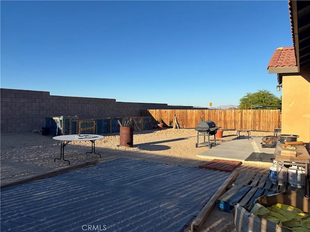 71578 Florida Dr Unit 29, Palms, CA 92277 - view of patio / terrace featuring a fenced backyard and area for grilling