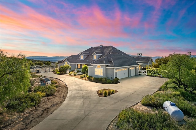 40267 Scanlon Rd, Temecula, CA 92592 - view of front facade with fence, curved driveway, and an attached garage