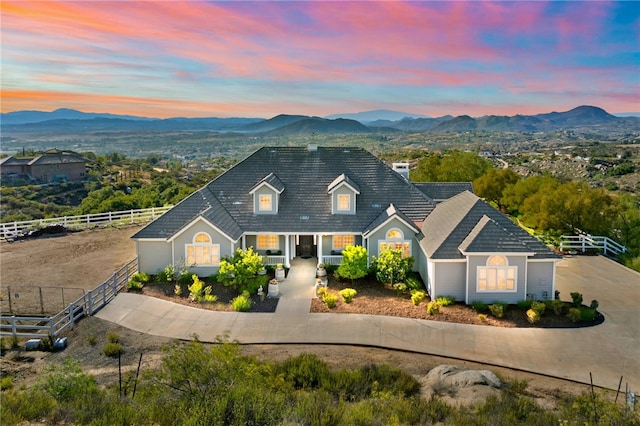 40267 Scanlon Rd, Temecula, CA 92592 - view of front of home with fence, covered porch, a mountain view, and a chimney