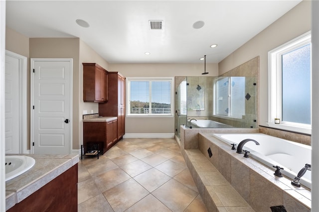 40267 Scanlon Rd, Temecula, CA 92592 - bathroom featuring vanity, a stall shower, plenty of natural light, a bath, and recessed lighting