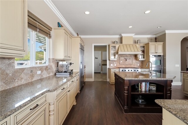 40267 Scanlon Rd, Temecula, CA 92592 - kitchen with cream cabinets, open shelves, appliances with stainless steel finishes, baseboards, and tasteful backsplash
