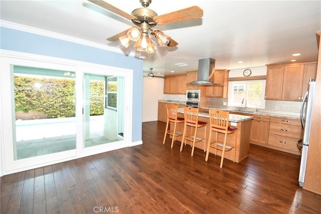 5309 Emerald St, Torrance, CA 90503 - kitchen with exhaust hood, appliances with stainless steel finishes, plenty of natural light, a center island, and crown molding