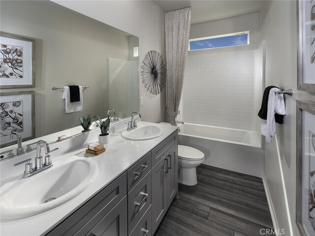 35232 Lopez Ln, Beaumont, CA 92223 - full bath featuring toilet, double vanity, wood finished floors, and bathing tub / shower combination