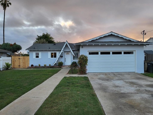 852 5th St, Imperial Beach, CA 91932 - view of front of home featuring concrete driveway, stucco siding, an attached garage, and roof with shingles