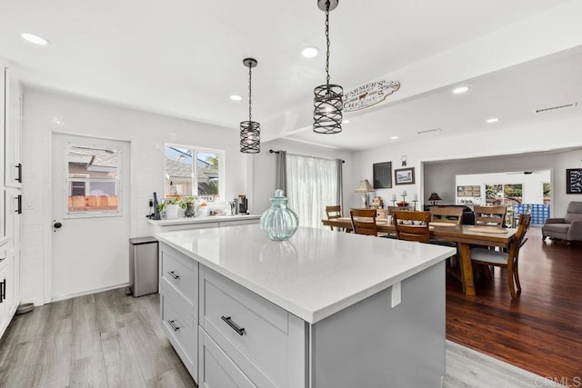 852 5th St, Imperial Beach, CA 91932 - kitchen featuring recessed lighting, light countertops, light wood finished floors, a center island, and open floor plan