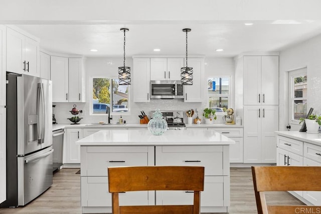 852 5th St, Imperial Beach, CA 91932 - kitchen featuring appliances with stainless steel finishes, a sink, plenty of natural light, light wood finished floors, and recessed lighting