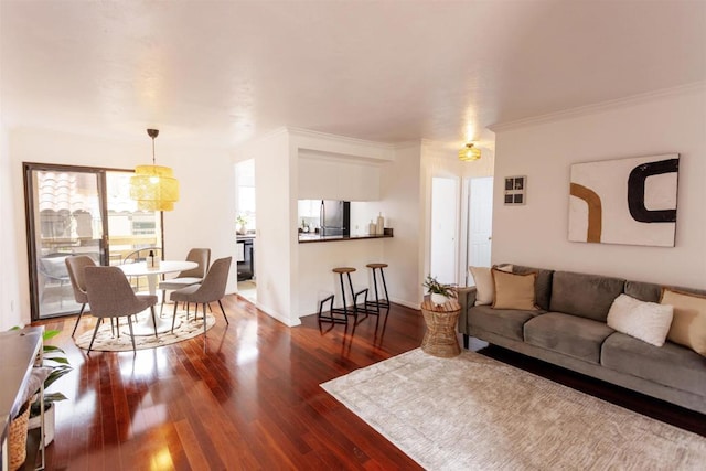 1002 30th St Unit 206, San Diego, CA 92102 - living room featuring dark wood finished floors, crown molding, and baseboards