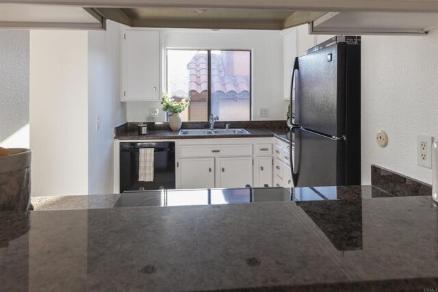 1002 30th St Unit 206, San Diego, CA 92102 - kitchen featuring black appliances, a sink, white cabinets, and a textured wall