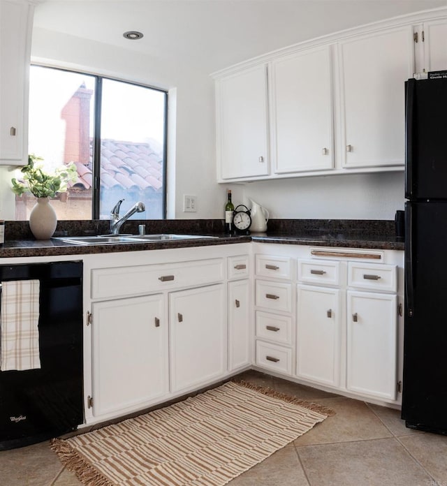1002 30th St Unit 206, San Diego, CA 92102 - kitchen with black appliances, a sink, white cabinets, light tile patterned flooring, and dark countertops
