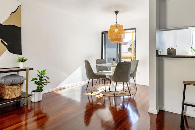 1002 30th St Unit 206, San Diego, CA 92102 - dining area featuring wood finished floors, baseboards, and ornamental molding