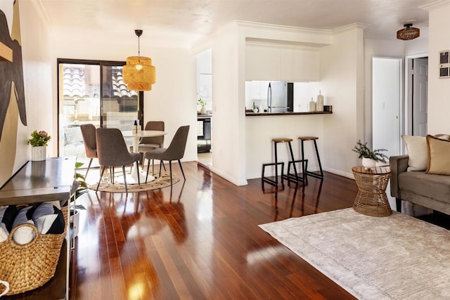 1002 30th St Unit 206, San Diego, CA 92102 - living area featuring dark wood-style flooring, ornamental molding, and baseboards