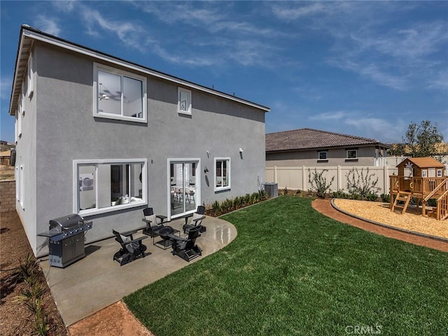 35208 Lopez Ln, Beaumont, CA 92223 - back of house with stucco siding, a patio area, a playground, and central air condition unit