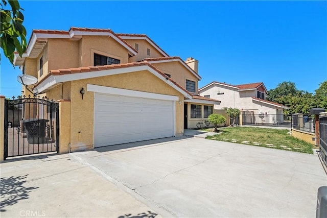 view of front of property featuring concrete driveway, stucco siding, a gate, a garage, and a chimney