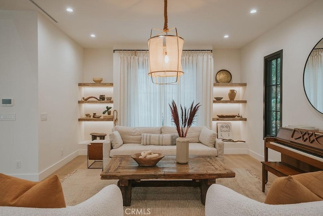 10 Seabluff, Newport Beach, CA 92660 - living area featuring light wood-style floors, baseboards, recessed lighting, and healthy amount of natural light