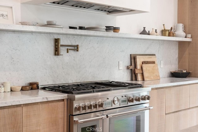 10 Seabluff, Newport Beach, CA 92660 - kitchen featuring range with two ovens, custom range hood, backsplash, and modern cabinets