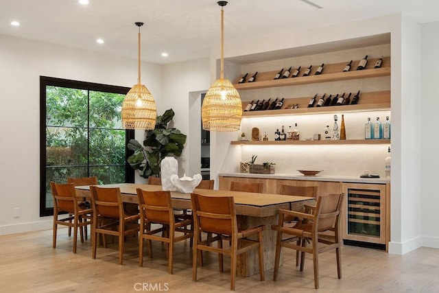10 Seabluff, Newport Beach, CA 92660 - indoor bar with beverage cooler, light wood finished floors, recessed lighting, baseboards, and decorative light fixtures