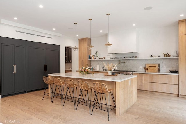 10 Seabluff, Newport Beach, CA 92660 - kitchen with open shelves, backsplash, light wood-style floors, and recessed lighting