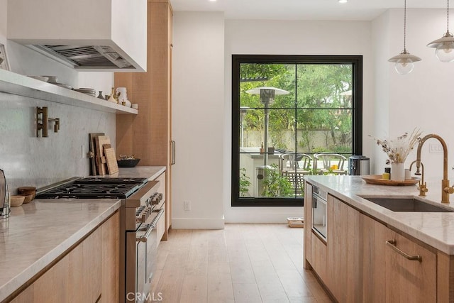 10 Seabluff, Newport Beach, CA 92660 - kitchen featuring stainless steel range, premium range hood, a sink, light brown cabinetry, and recessed lighting