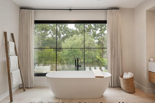 10 Seabluff, Newport Beach, CA 92660 - bathroom featuring a freestanding bath, baseboards, and tile patterned flooring