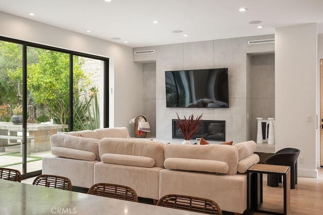 10 Seabluff, Newport Beach, CA 92660 - living area featuring wood finished floors, recessed lighting, and a high end fireplace