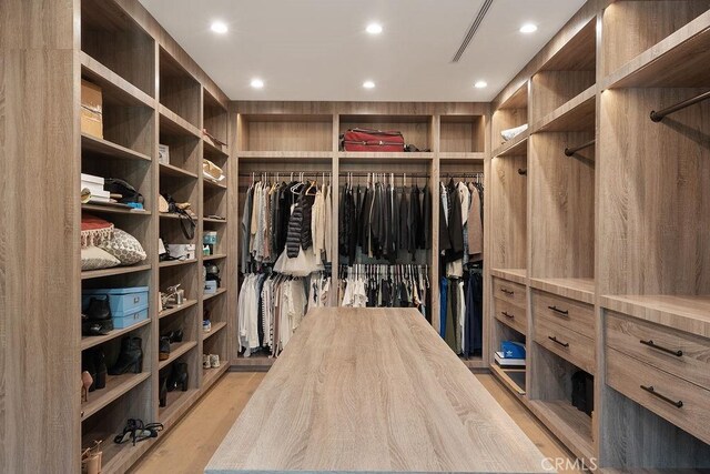 10 Seabluff, Newport Beach, CA 92660 - walk in closet with light wood-style floors
