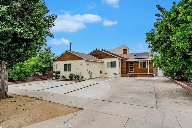 8957 Amigo Ave, Northridge, CA 91324 - view of front of home featuring roof mounted solar panels