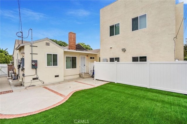 8957 Amigo Ave, Northridge, CA 91324 - back of house with stucco siding, entry steps, a patio, and a chimney