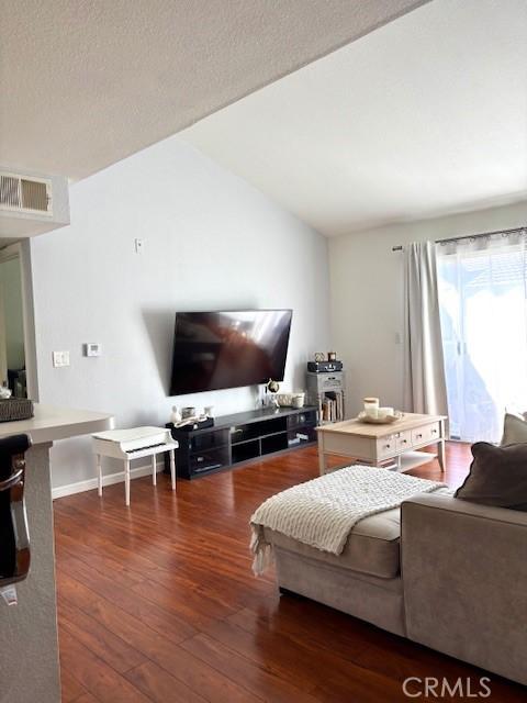 15000 Downey Ave Unit 273, Paramount, CA 90723 - living room with hardwood / wood-style flooring and vaulted ceiling