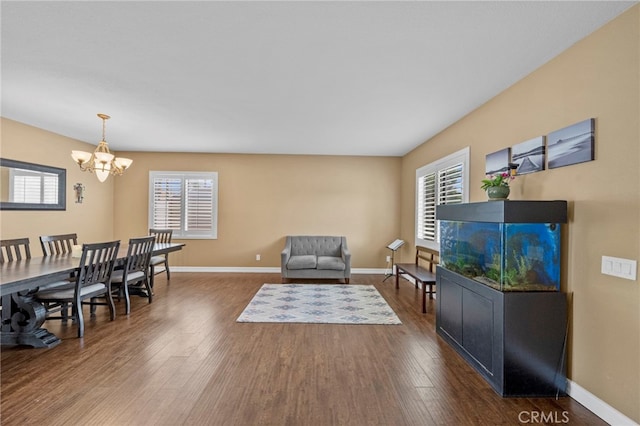 37628 Flora Ct, Murrieta, CA 92563 - dining space with a chandelier, healthy amount of natural light, dark wood-style flooring, and baseboards