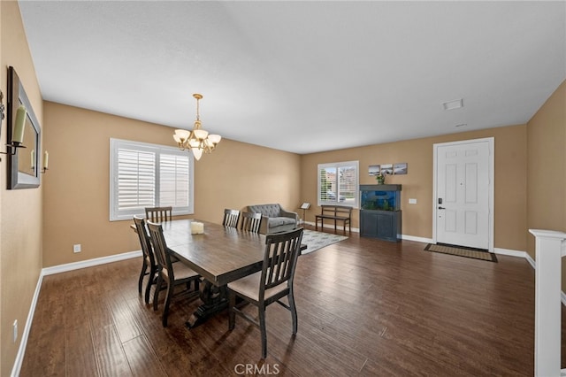 37628 Flora Ct, Murrieta, CA 92563 - dining space with dark wood-style flooring, baseboards, and a chandelier
