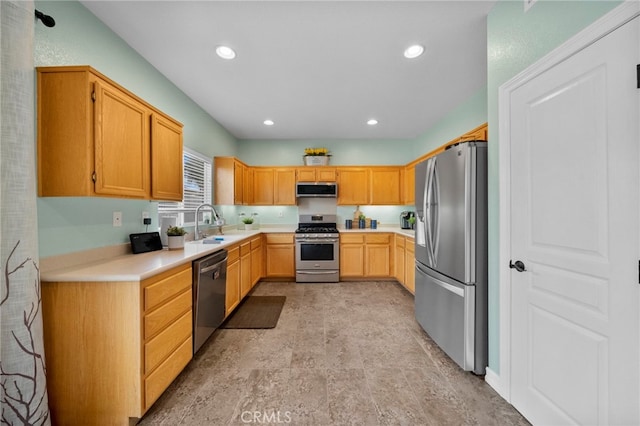 37628 Flora Ct, Murrieta, CA 92563 - kitchen with stainless steel appliances, a sink, light countertops, and recessed lighting