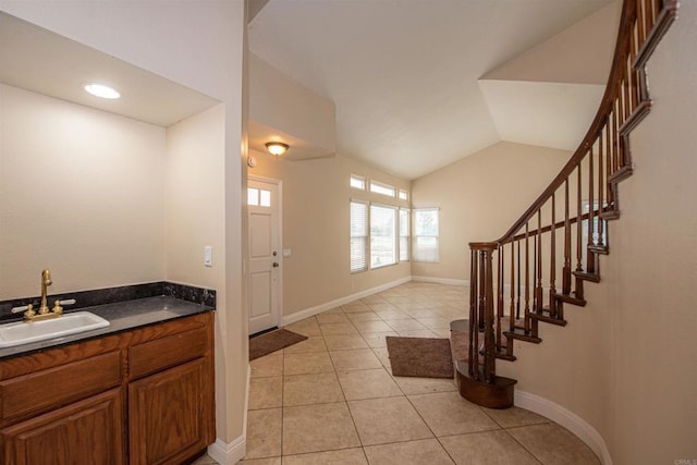 28679 Corte Capri, Menifee, CA 92584 - foyer featuring light tile patterned floors, vaulted ceiling, stairs, and baseboards