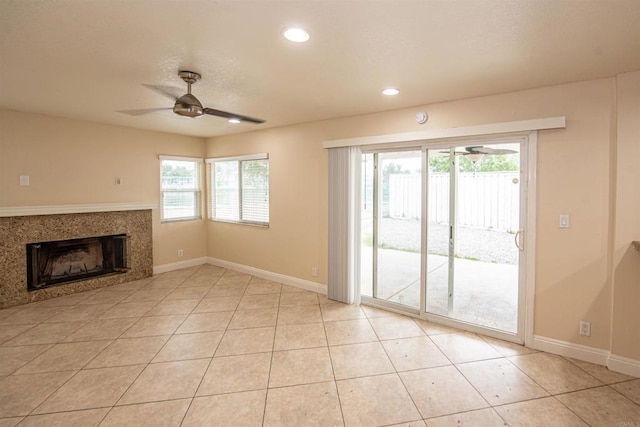 28679 Corte Capri, Menifee, CA 92584 - unfurnished living room featuring a ceiling fan, plenty of natural light, baseboards, a fireplace, and recessed lighting