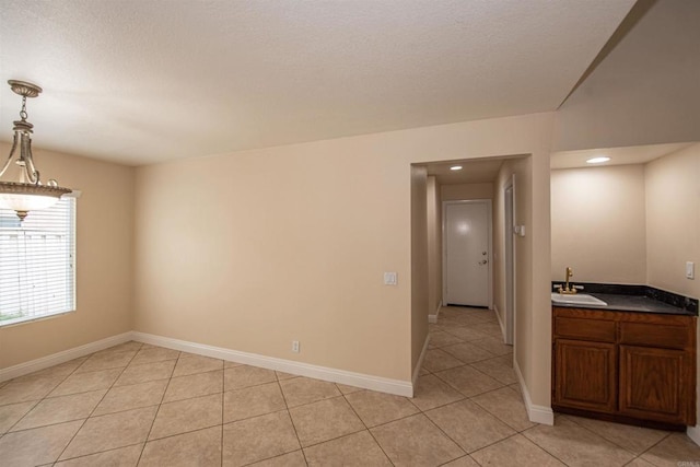 28679 Corte Capri, Menifee, CA 92584 - spare room with a sink, light tile patterned floors, baseboards, and recessed lighting