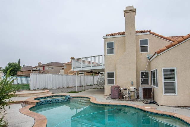28679 Corte Capri, Menifee, CA 92584 - view of swimming pool with a pool with connected hot tub, a patio, and central air condition unit