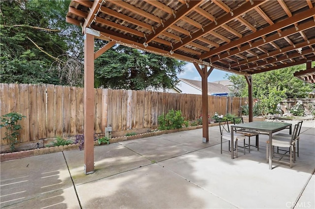 1958 Fall Brook Ct, Merced, CA 95340 - view of patio with outdoor dining area and a fenced backyard