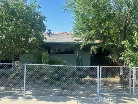 212 N 7th Ave, Avenal, CA 93204 - obstructed view of property featuring fence