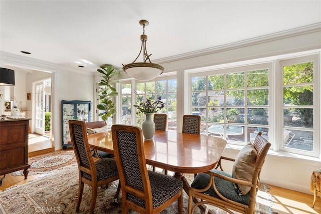 5132 Quakertown Ave, Woodland Hills, CA 91364 - dining room with light wood-style flooring and crown molding