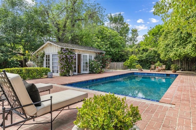5132 Quakertown Ave, Woodland Hills, CA 91364 - view of swimming pool with an exterior structure, a fenced backyard, an outbuilding, and a patio