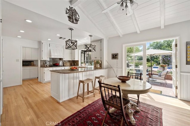 5132 Quakertown Ave, Woodland Hills, CA 91364 - kitchen with light wood-type flooring, custom range hood, white cabinets, a peninsula, and recessed lighting