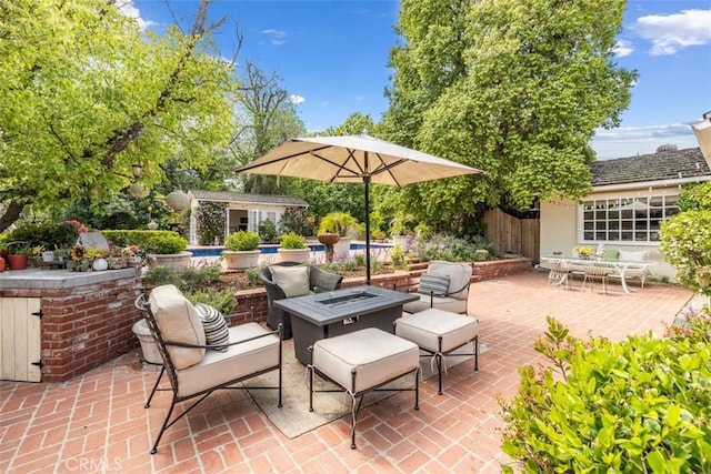 5132 Quakertown Ave, Woodland Hills, CA 91364 - view of patio featuring an outdoor structure and a fire pit