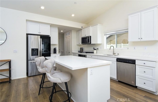 28400 Memory Ln, Winchester, CA 92596 - kitchen with appliances with stainless steel finishes, a sink, a kitchen island, white cabinets, and a kitchen bar