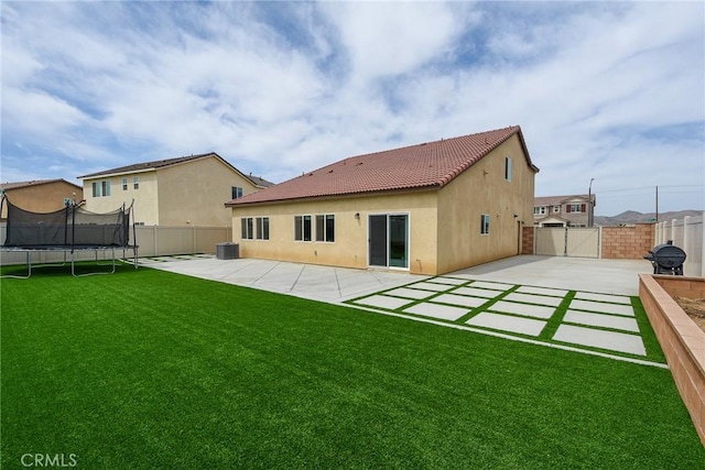 28400 Memory Ln, Winchester, CA 92596 - rear view of house with a patio, a tile roof, stucco siding, and a trampoline