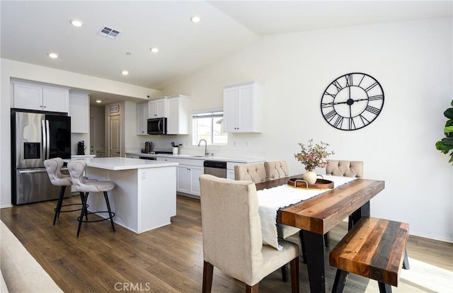 28400 Memory Ln, Winchester, CA 92596 - kitchen with stainless steel appliances, a center island, a kitchen breakfast bar, lofted ceiling, and light countertops