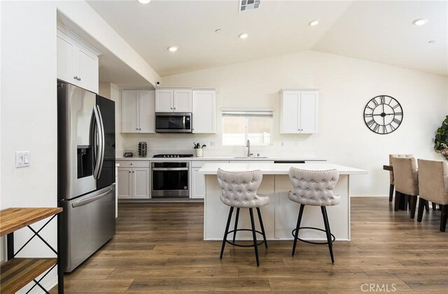 28400 Memory Ln, Winchester, CA 92596 - kitchen with appliances with stainless steel finishes, a sink, light countertops, a center island, and vaulted ceiling