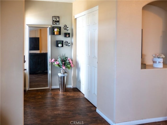 66659 El Dorado Pl, Desert Hot Springs, CA 92240 - corridor featuring dark wood-type flooring and arched walkways
