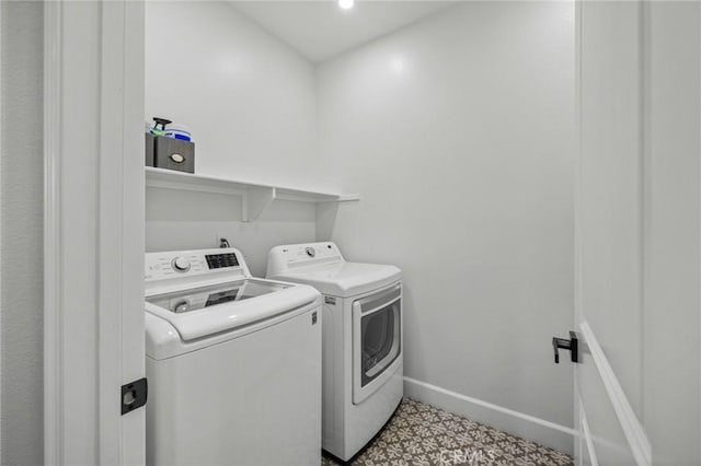 clothes washing area with washer and dryer, tile patterned floors, baseboards, and recessed lighting